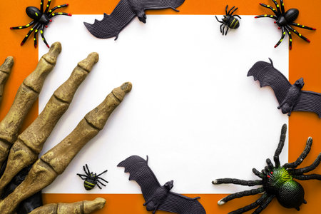 Halloween mock up, blank sheet of paper with spiders, bats and monsters handの写真素材