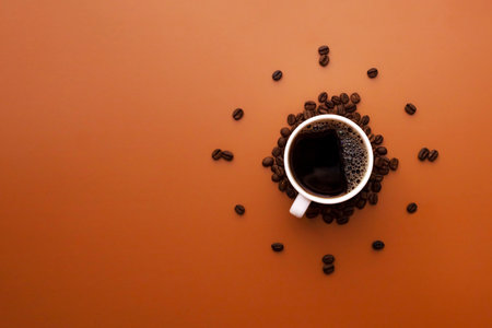 White coffee cup on brown background with coffee beans forming clock faceの写真素材