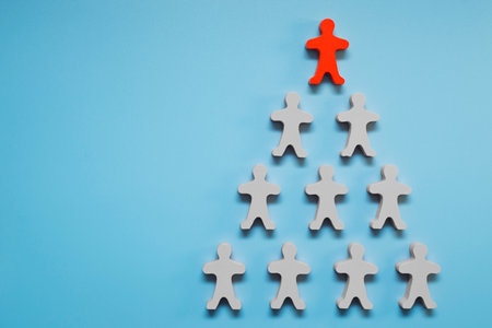 Team of toy people on blue background.の写真素材