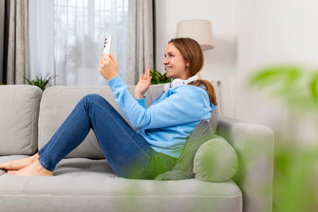 Woman Enjoying Video Call on Smartphoneの写真素材