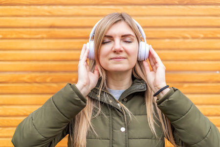 Young Woman Enjoying Music on Headphonesの写真素材