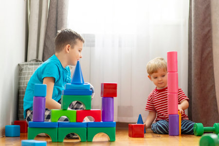 Creative Playtime Children with Colorful Building Blocksの写真素材