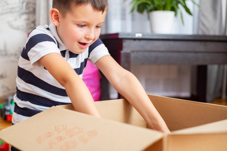 Child Excited by Surprise in Boxの写真素材
