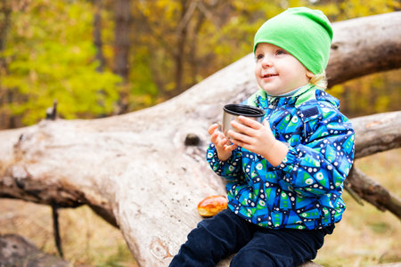 Child Enjoying Break on Nature Hikeの写真素材