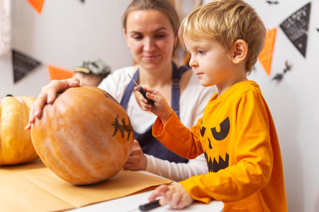 Family Carving Pumpkin for Halloweenの写真素材