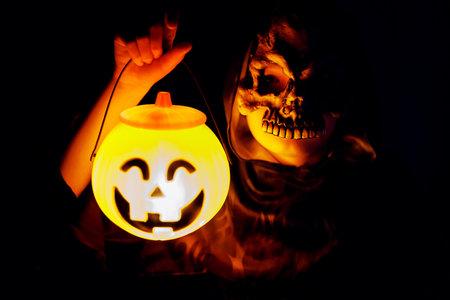 Scary Child Holding Halloween Pumpkin Lanternの写真素材