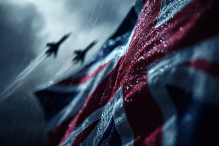 A cinematic scene featuring the British flag under soft rain, with jets piercing through dramatic clouds into light, creating a powerful and atmospheric visual.の素材