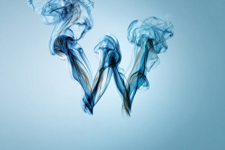 The letter W is artistically formed by intertwined smoke ribbons, creating a mirrored and fluid structure on a light ocean-blue background. Ideal for creative design projects.の素材