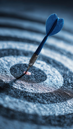 Macro image of a blue dart embedded in a bullseye, showcasing precision. The shallow depth of field and soft tones emphasize focus and accuracy in a symbolic manner.の素材