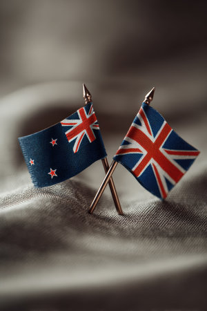 A minimalistic portrait featuring the New Zealand and Iceland flags together, set against a neutral backdrop with silky highlights, emphasizing their iconic designs.の素材