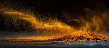 Abstract photography capturing turmeric powder in motion with an artistic blur. The golden dust creates a surreal light effect, evoking a sense of dynamic movement.の素材