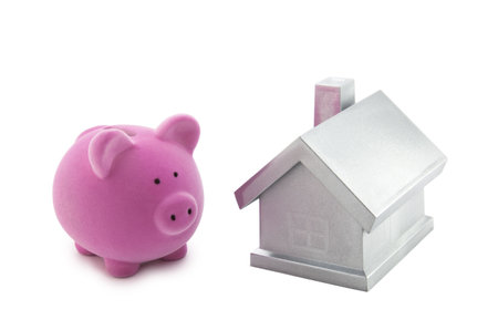 Piggy bank and silver house の写真素材