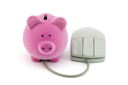 Piggy bank with computer mouseの写真素材