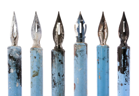 Collection of old blue pens isolated on whiteの写真素材
