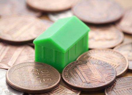 Miniature green house on US coinsの写真素材