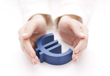 Euro sign protected by handsの写真素材