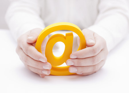 3d email symbol protected by handsの写真素材