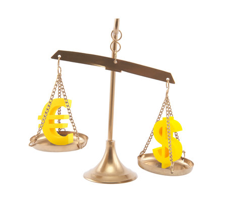 Euro and Dollar signs on scales isolated on whiteの写真素材