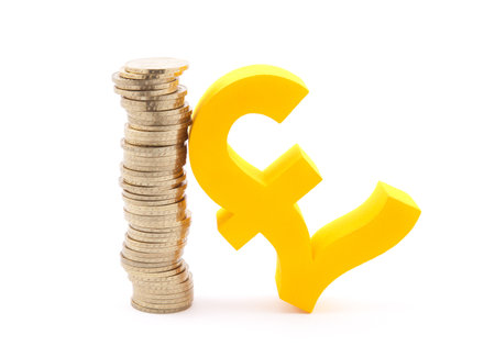 Stack of gold coins and pound symbolの写真素材