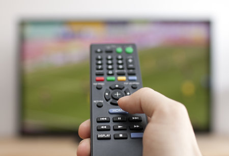 Hand pressing remote controlの写真素材