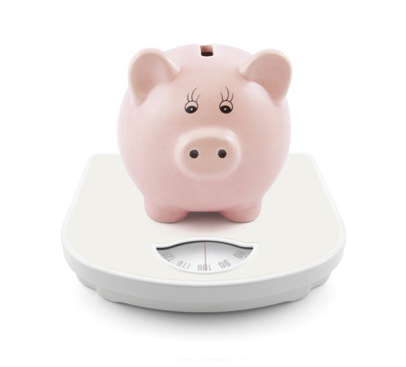 Piggy bank on scalesの写真素材