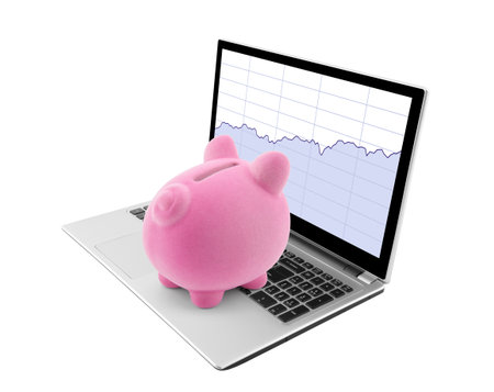 Piggy bank looking at laptop with stock chartsの写真素材