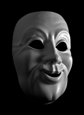 White mask against a dark background の写真素材
