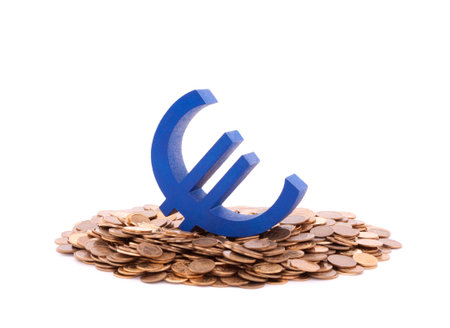 Blue euro symbol with pile of coinsの写真素材