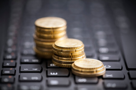 Rising coins on keyboardの写真素材