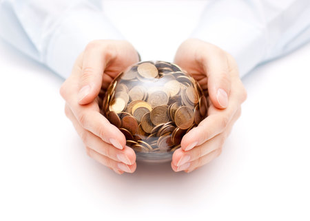 Crystal ball with money in handsの写真素材