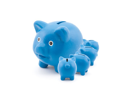 Blue piggy banks feeding from their motherの写真素材