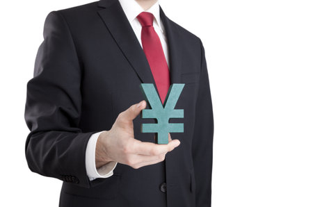 Businessman holding yen sign with clipping pathの写真素材