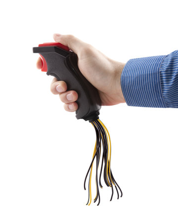 Computer joystick with cables in hand isolated on whiteの写真素材