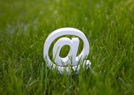 Email sign on green grassの写真素材