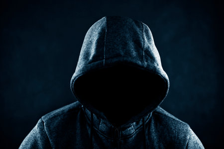 Hooded man in the darkの写真素材