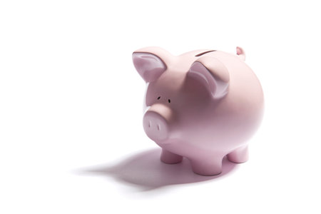 Pink piggy bank on white backgroundの写真素材