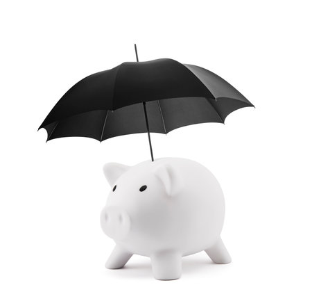 Financial insurance. White piggy bank with umbrellaの写真素材