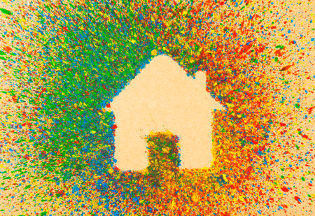 House shape over background with colorful splashesの写真素材