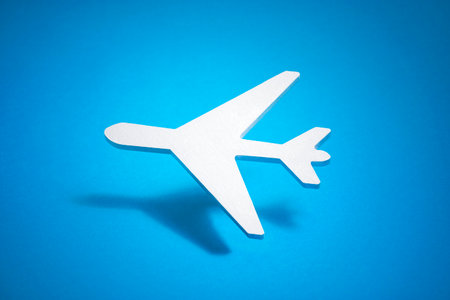 Airplane shape over blue backgroundの写真素材