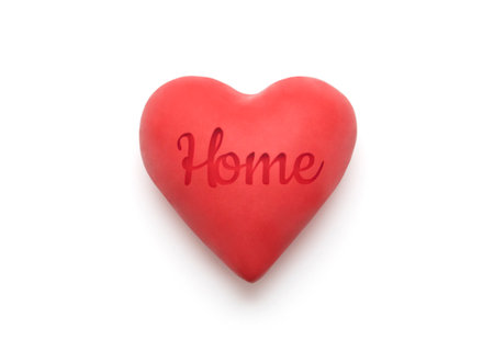 Red heart with imprinted home word over white background with clipping pathの写真素材