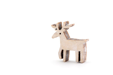 Wooden reindeer Christmas decoration on white backgroundの写真素材