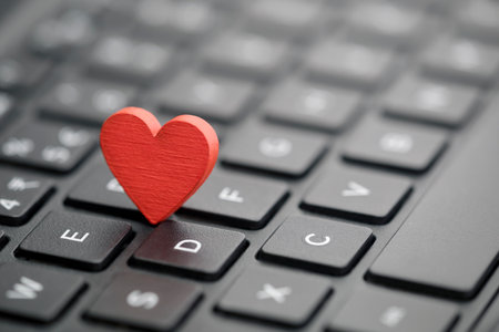 Small red heart on keyboard. Internet dating concept.の写真素材