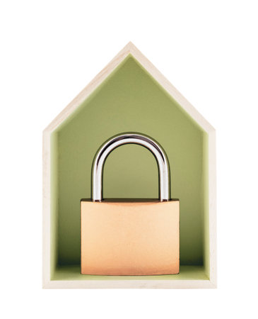 House protection concept. Small wooden house with metal padlock isolated on white backgroundの写真素材