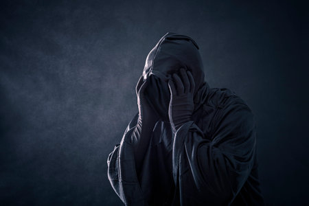 Scary figure in hooded cloakの写真素材