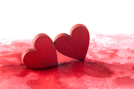 Two red hearts on a bloody backgroundの写真素材
