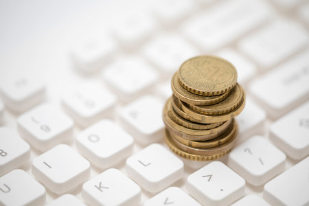 Euro coins on computer keyboard
