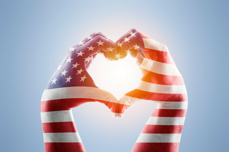 Two hands in the form of heart with USA flagの写真素材