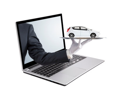 Businessman offering a laptop on a white backgroundの写真素材