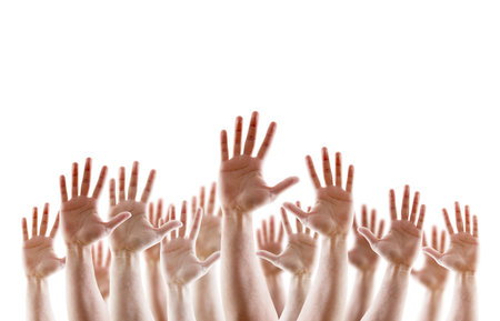 Group of raised hands with open palms isolated on white backgroundの写真素材