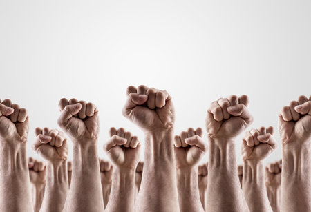 Large group of raised hands showing fistsの写真素材